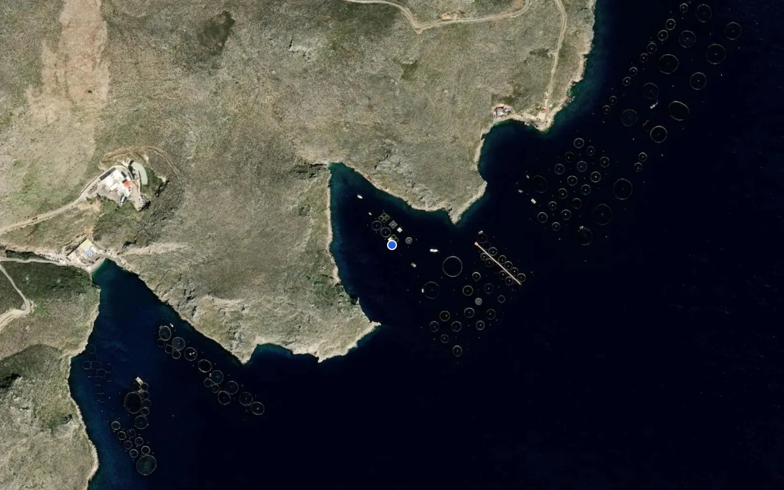 Satellite and nautical chart view of Kamila Bay